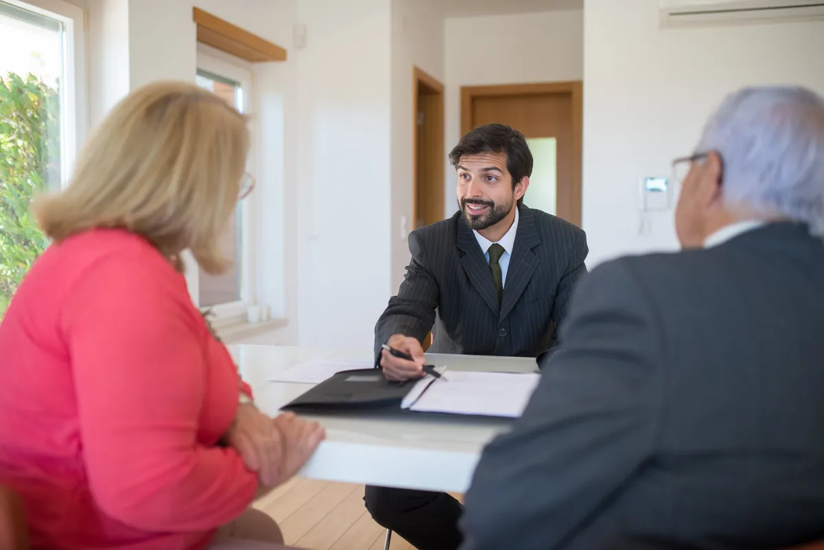 Two people consulting a mortgage broker