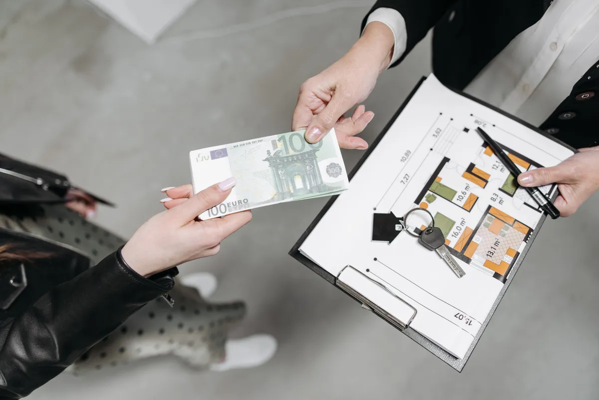 A client handing a payment to landlord